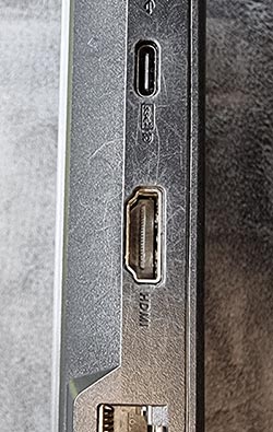 An image of scratches around the USB and HDMI ports on a refurbished laptop. 